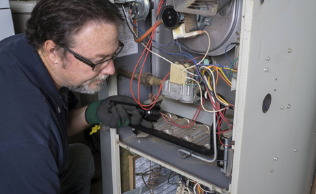 Licensed technician performing furnace repair in Oshawa during a no-heat emergency