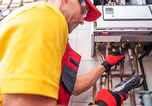 HVAC technician inspecting a furnace to diagnose short cycling