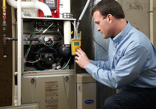 Furnace short cycling being diagnosed on a gas furnace in a Durham home by Aire One East