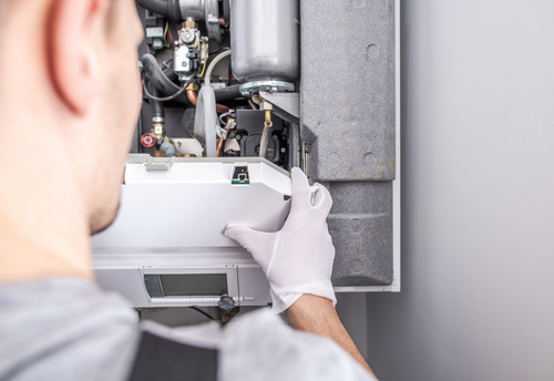 Furnace maintenance on a gas furnace in a Durham home by Aire One East