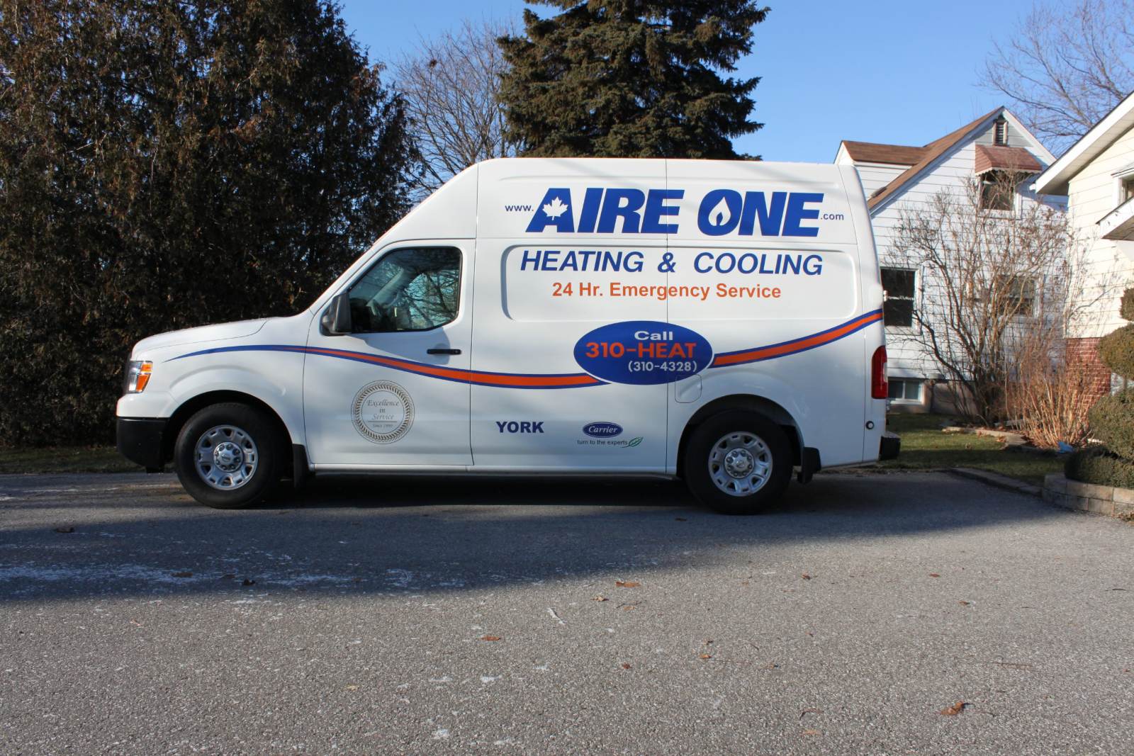 Aire One East Heating and Cooling technician servicing a home HVAC system in Durham Region
