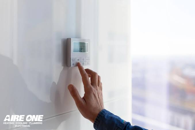Winter thermostat settings on a home thermostat in a Durham home by Aire One East