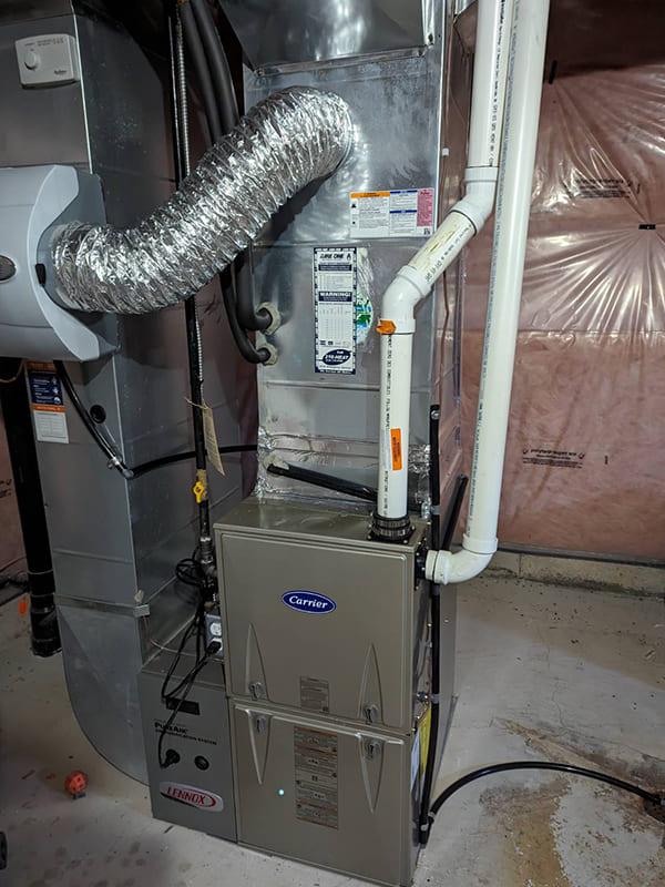 Aire One East technician inspecting ductwork to prevent air duct cleaning damage in Durham Region