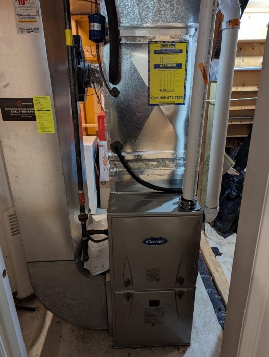 Carrier high-efficiency furnace installed with new ductwork and venting